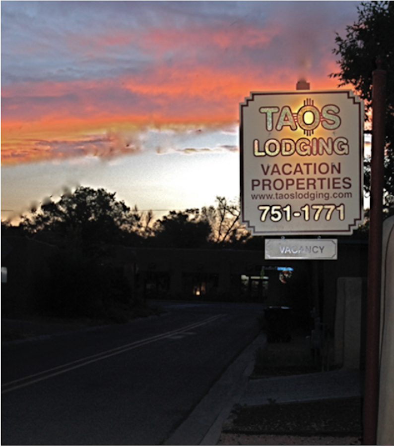 Taos Lodge Sign Nighttime photo